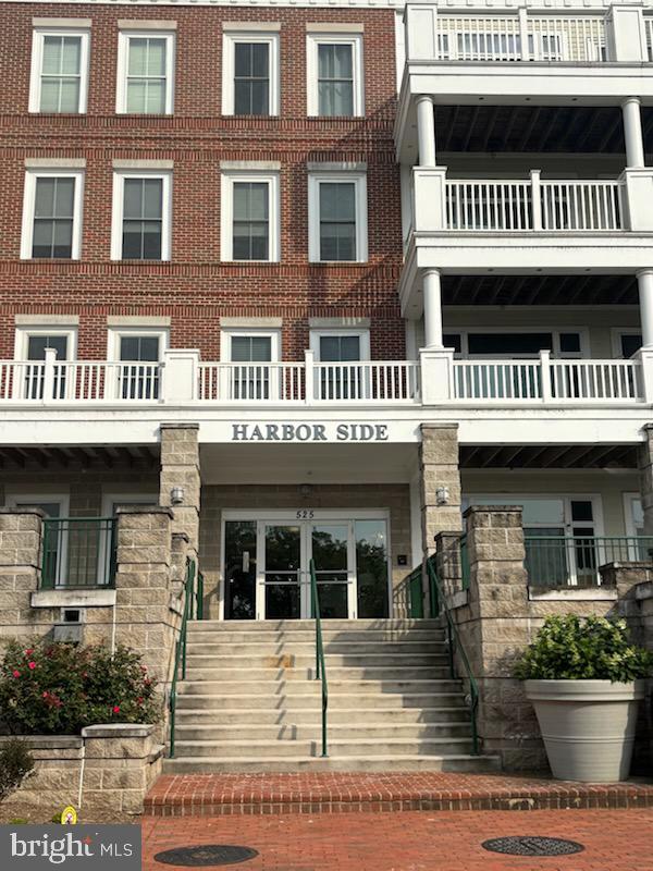 525 Belmont Bay Dr Unit 105, Woodbridge, VA 22191 - view of front of house with stairs and brick siding