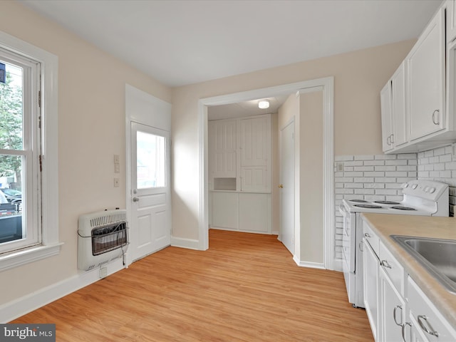 3 S Pine St, Middletown, PA 17057 - kitchen featuring heating unit, white electric range, healthy amount of natural light, and light wood-type flooring