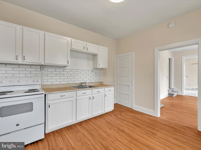 3 S Pine St, Middletown, PA 17057 - kitchen with white electric range oven, light wood-style floors, and white cabinets