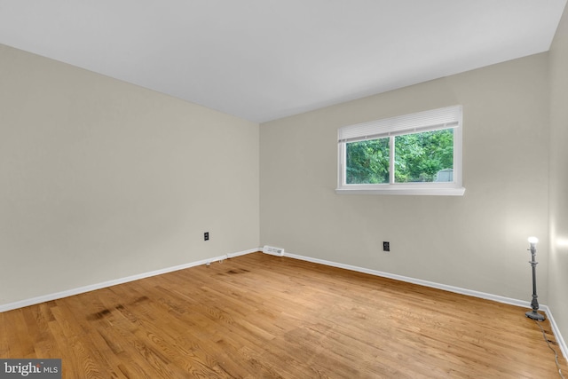 8000 Dellwood Ave, Glenarden, MD 20706 - spare room featuring wood finished floors and baseboards