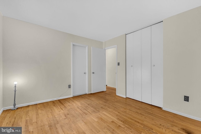 8000 Dellwood Ave, Glenarden, MD 20706 - unfurnished bedroom featuring light wood-type flooring and baseboards