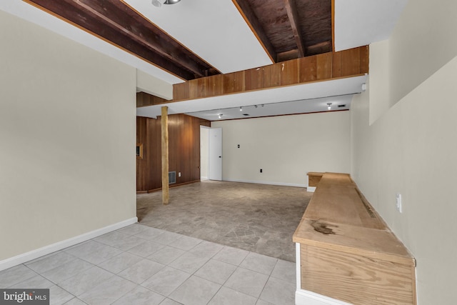 8000 Dellwood Ave, Glenarden, MD 20706 - empty room with light carpet, light tile patterned floors, wood walls, and beam ceiling