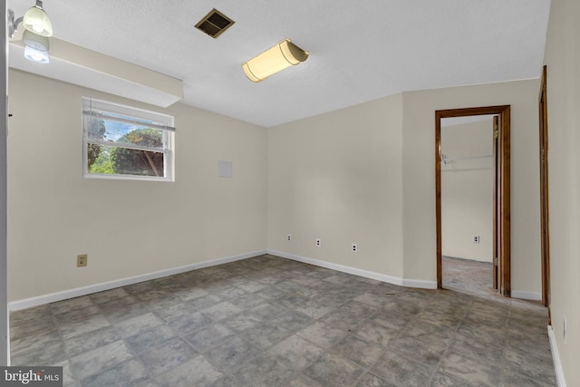 8000 Dellwood Ave, Glenarden, MD 20706 - empty room featuring a textured ceiling