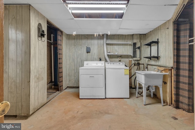 8000 Dellwood Ave, Glenarden, MD 20706 - laundry area featuring washer and dryer and wooden walls