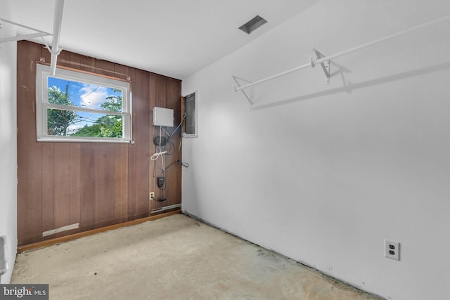 8000 Dellwood Ave, Glenarden, MD 20706 - entryway featuring wooden walls, concrete floors, and electric panel