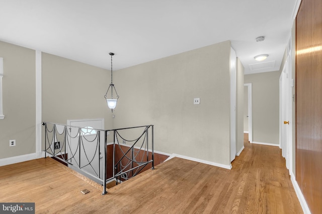 8000 Dellwood Ave, Glenarden, MD 20706 - hallway featuring an upstairs landing, wood finished floors, and attic access