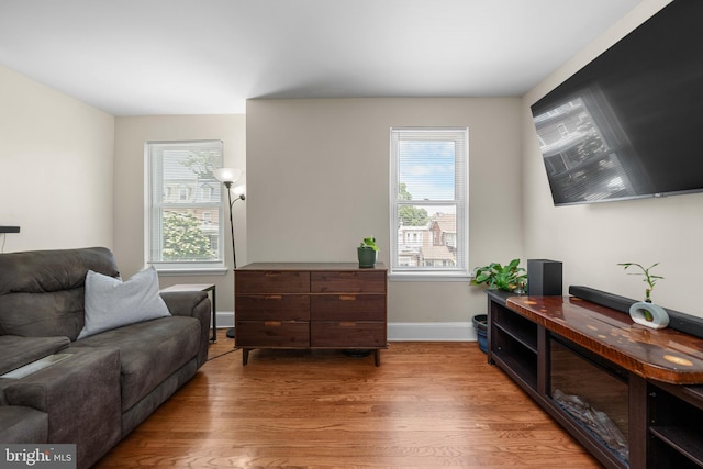 1002 W 9th St, Wilmington, DE 19806 - living area featuring wood finished floors and healthy amount of natural light