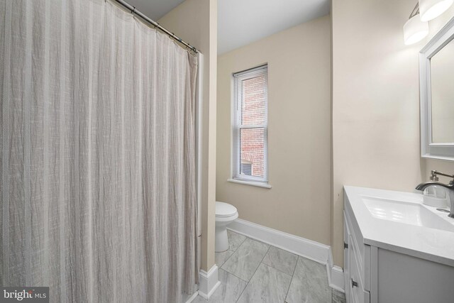 1002 W 9th St, Wilmington, DE 19806 - full bathroom featuring vanity and marble look tile flooring