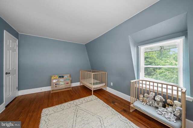 1002 W 9th St, Wilmington, DE 19806 - bedroom with wood finished floors and a nursery area