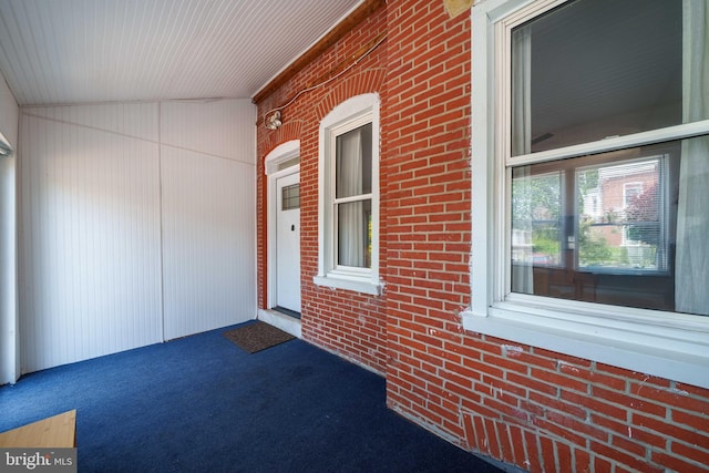 1002 W 9th St, Wilmington, DE 19806 - view of exterior entry featuring covered porch and brick siding