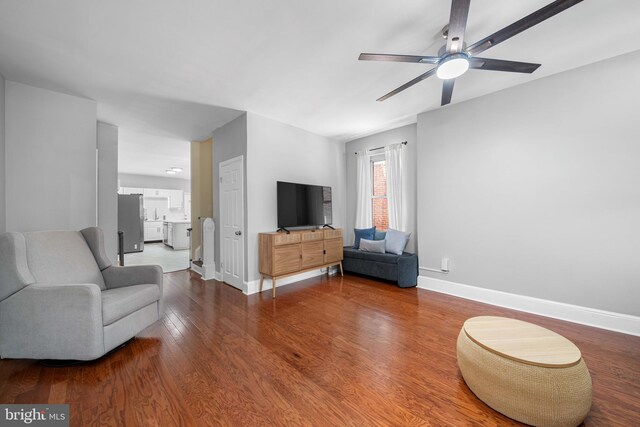 1002 W 9th St, Wilmington, DE 19806 - living area with ceiling fan and wood finished floors