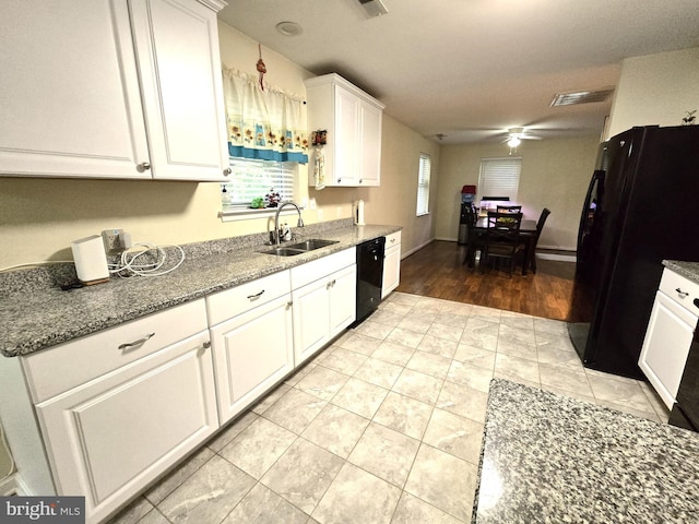 14722 Banks Odee Rd, Newburg, MD 20664 - kitchen featuring black appliances, white cabinets, ceiling fan, light tile patterned flooring, and stone countertops