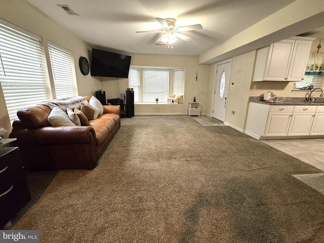 14722 Banks Odee Rd, Newburg, MD 20664 - living area featuring light carpet and a ceiling fan