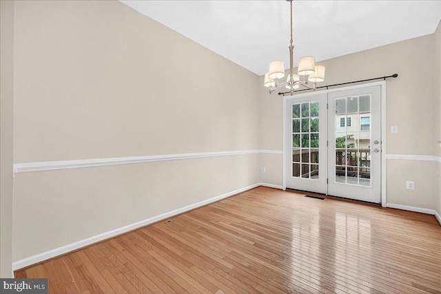 13102 Alpine Dr Unit 2502, Germantown, MD 20874 - unfurnished room featuring wood finished floors and a chandelier