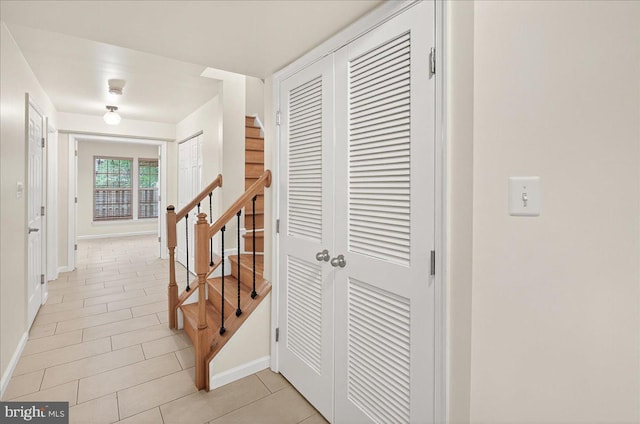 13102 Alpine Dr Unit 2502, Germantown, MD 20874 - corridor featuring light tile patterned flooring and stairway
