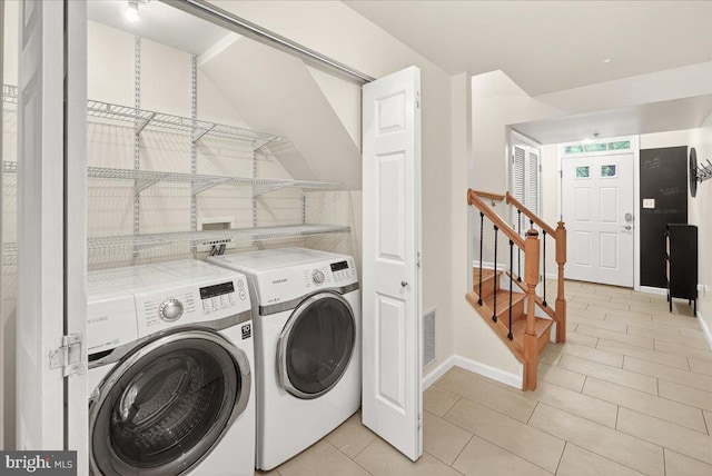 13102 Alpine Dr Unit 2502, Germantown, MD 20874 - laundry area featuring independent washer and dryer and light tile patterned floors