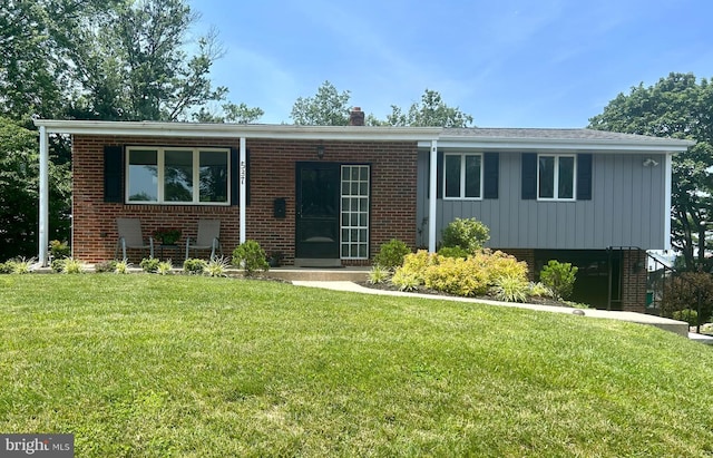 537 Princeton Dr, King Of Prussia, PA 19406 - view of front of property featuring brick siding, a front yard, and board and batten siding