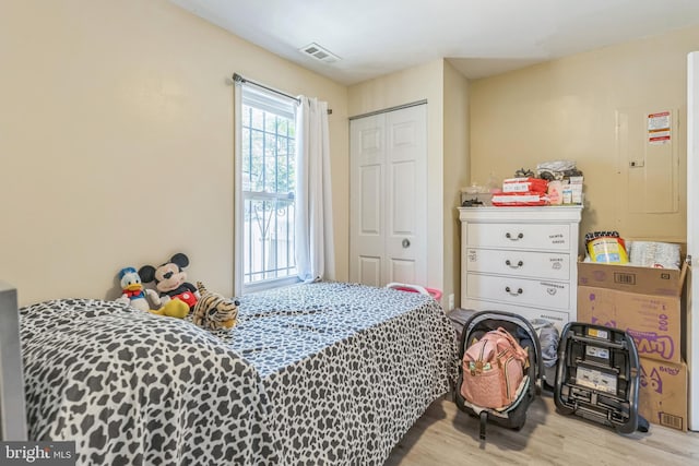1009 Jansen Ave, Capitol Heights, MD 20743 - bedroom featuring wood finished floors, electric panel, and a closet