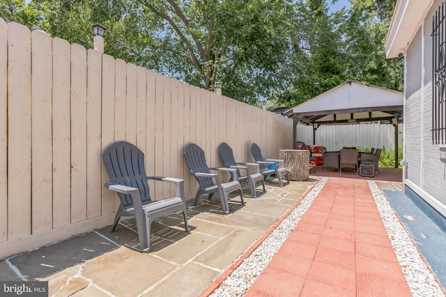 1009 Jansen Ave, Capitol Heights, MD 20743 - fenced backyard with a gazebo, a patio area, and a carport