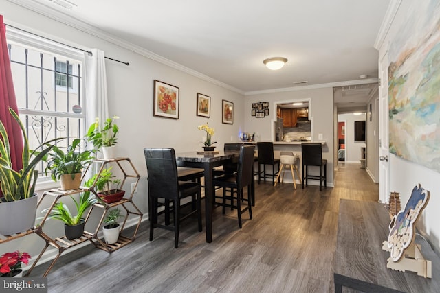 1009 Jansen Ave, Capitol Heights, MD 20743 - dining space with wood finished floors and ornamental molding
