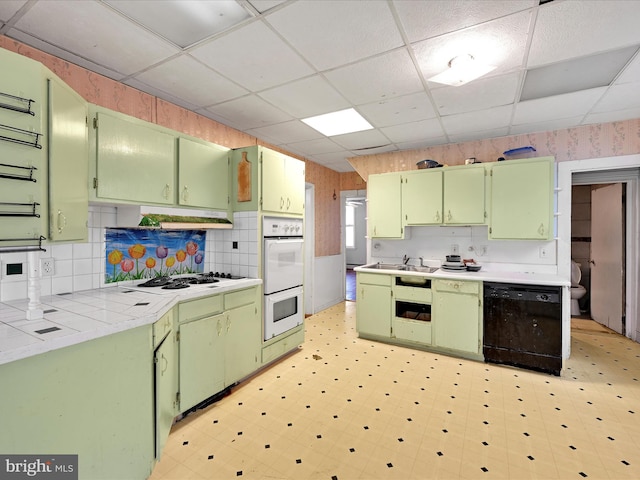 543 W Main Ave, Myerstown, PA 17067 - kitchen featuring green cabinetry, white appliances, and a paneled ceiling