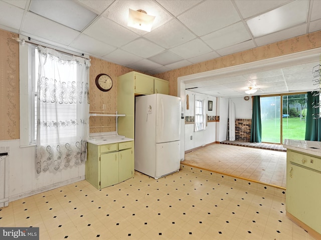 543 W Main Ave, Myerstown, PA 17067 - kitchen with freestanding refrigerator, green cabinetry, light flooring, a drop ceiling, and plenty of natural light