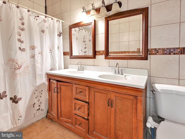 543 W Main Ave, Myerstown, PA 17067 - full bathroom featuring tile walls, double vanity, a shower with shower curtain, and tile patterned floors