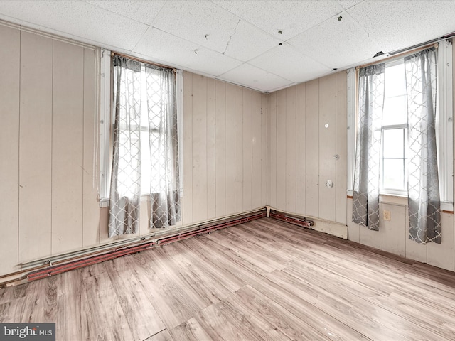 543 W Main Ave, Myerstown, PA 17067 - unfurnished room featuring wood finished floors, a drop ceiling, and wood walls