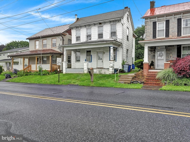 543 W Main Ave, Myerstown, PA 17067 - view of front of home featuring covered porch and a front yard