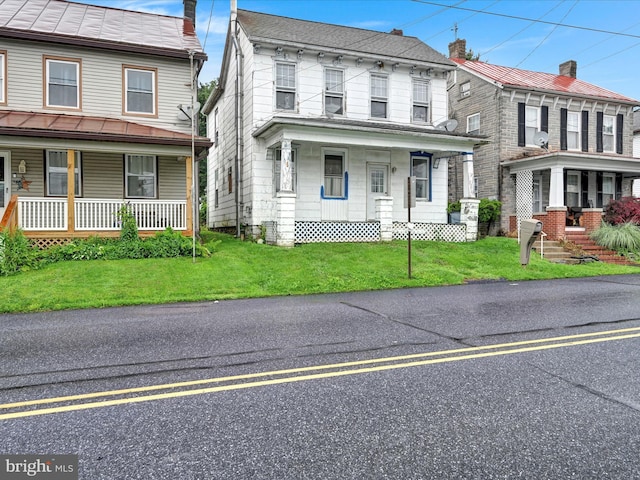 543 W Main Ave, Myerstown, PA 17067 - multi unit property with covered porch, a front lawn, and a chimney