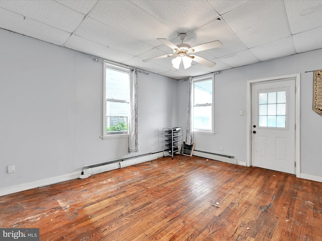 543 W Main Ave, Myerstown, PA 17067 - unfurnished room with ceiling fan, a paneled ceiling, hardwood / wood-style flooring, and baseboard heating