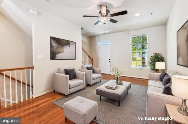 7226 Abbey Rd, Elkridge, MD 21075 - living room with wood finished floors, stairway, and ceiling fan