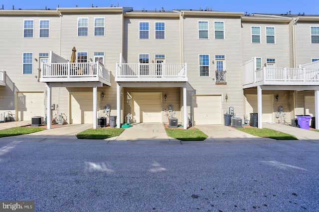 7226 Abbey Rd, Elkridge, MD 21075 - back of house featuring a garage and driveway