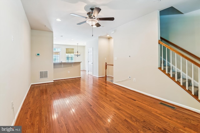 7226 Abbey Rd, Elkridge, MD 21075 - unfurnished living room featuring hardwood / wood-style floors, ceiling fan, a chandelier, and recessed lighting