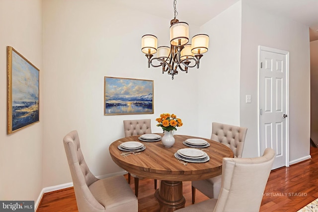 7226 Abbey Rd, Elkridge, MD 21075 - dining area with a chandelier and wood finished floors