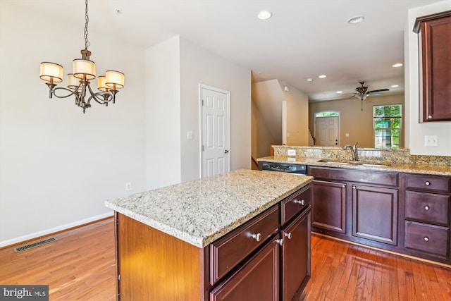 7226 Abbey Rd, Elkridge, MD 21075 - kitchen featuring hardwood / wood-style floors, ceiling fan, a chandelier, recessed lighting, and a center island