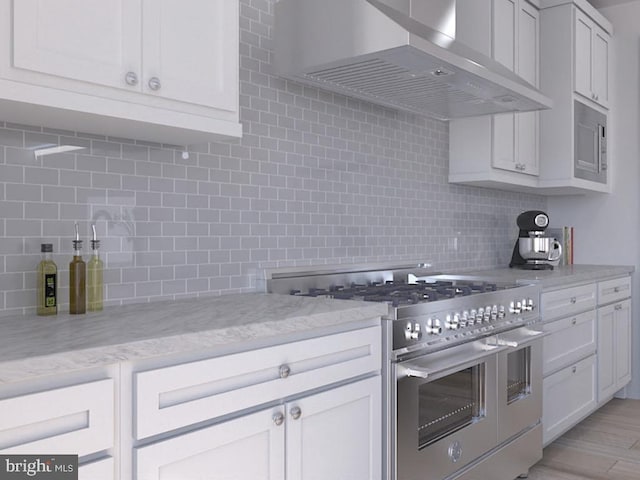 0 Surge Way, Carlisle, PA 17015 - kitchen with high end stainless steel range, wall chimney exhaust hood, tasteful backsplash, and light stone countertops