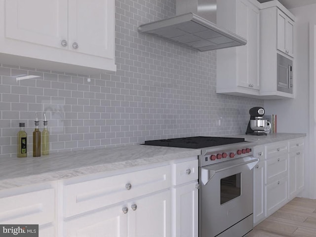 0 Surge Way, Carlisle, PA 17015 - kitchen featuring exhaust hood, high end stainless steel range, decorative backsplash, and white cabinets