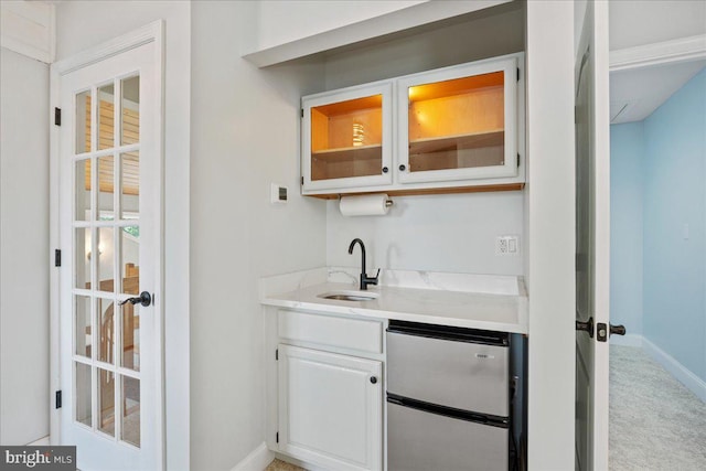 194 Harbor Dr, Lusby, MD 20657 - indoor wet bar with stainless steel refrigerator and carpet