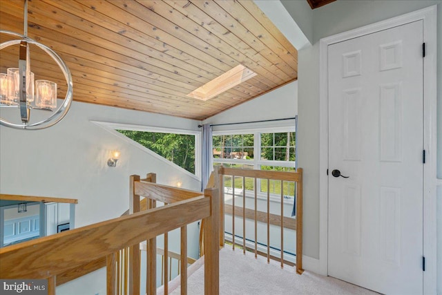 194 Harbor Dr, Lusby, MD 20657 - hallway with carpet flooring, an upstairs landing, a chandelier, wooden ceiling, and plenty of natural light