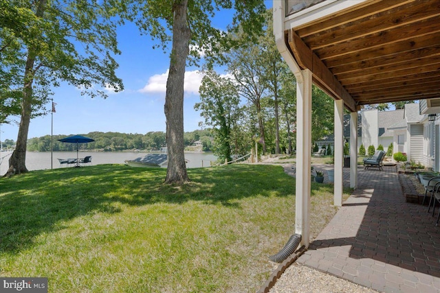 194 Harbor Dr, Lusby, MD 20657 - view of green lawn with a water view and a patio