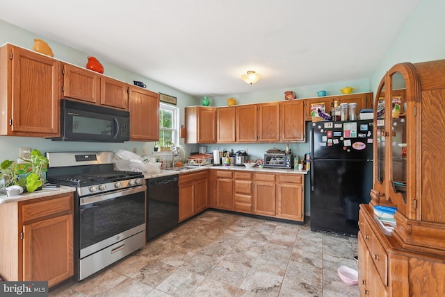 54 Victory Way, Royersford, PA 19468 - kitchen with black appliances, light countertops, stone finish flooring, and brown cabinets