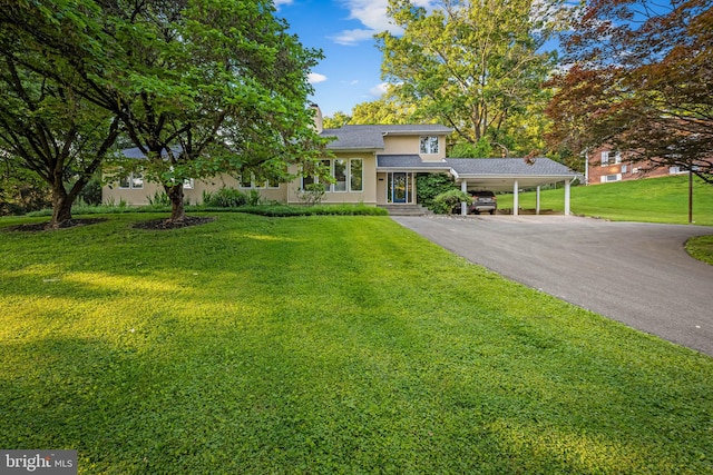 11824 Mays Chapel Rd, Lutherville Timonium, MD 21093 - view of front of property featuring stucco siding, asphalt driveway, and a front yard