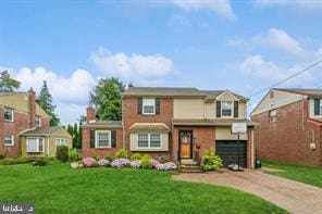 631 Radnor Ave, Haddonfield, NJ 08033 - traditional home featuring a front yard, driveway, and an attached garage