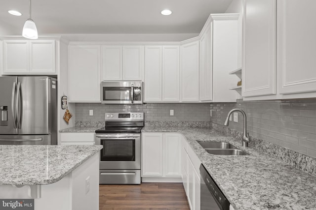 612 Cypress Dr Unit 51, Hanover, PA 17331 - kitchen featuring stainless steel appliances, recessed lighting, white cabinetry, backsplash, and light stone countertops