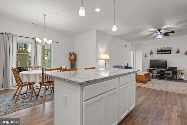 612 Cypress Dr Unit 51, Hanover, PA 17331 - kitchen featuring dark wood finished floors, a kitchen island, open floor plan, a ceiling fan, and a chandelier