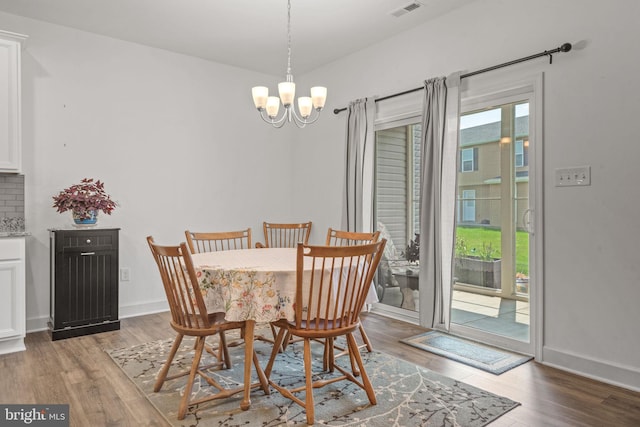 612 Cypress Dr Unit 51, Hanover, PA 17331 - dining room featuring wood finished floors and a chandelier