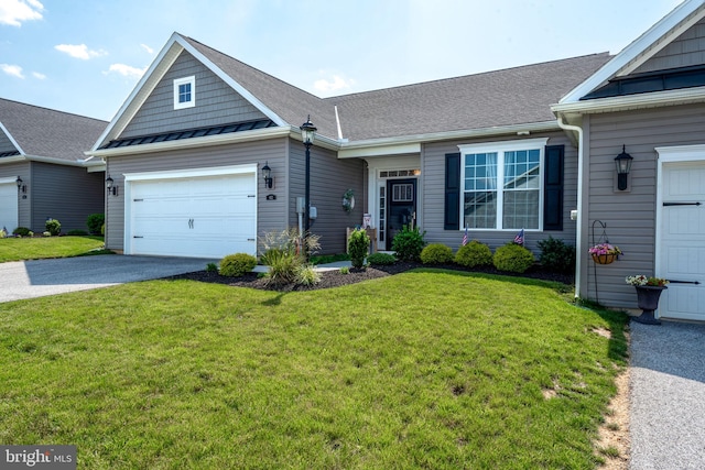 612 Cypress Dr Unit 51, Hanover, PA 17331 - view of front of house with asphalt driveway, a front lawn, an attached garage, and a standing seam roof