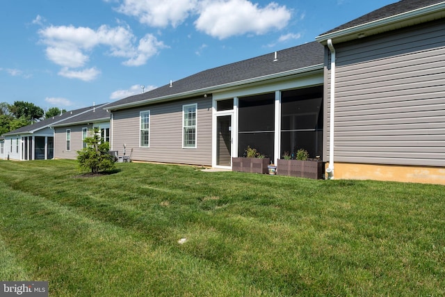612 Cypress Dr Unit 51, Hanover, PA 17331 - rear view of property with a lawn and a sunroom