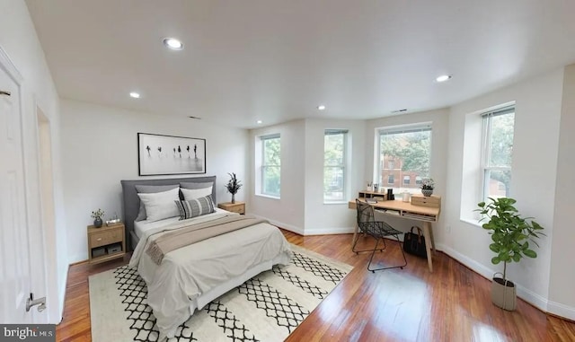 75 New York Ave NW, Washington, DC 20001 - bedroom featuring multiple windows, light wood-style flooring, and recessed lighting